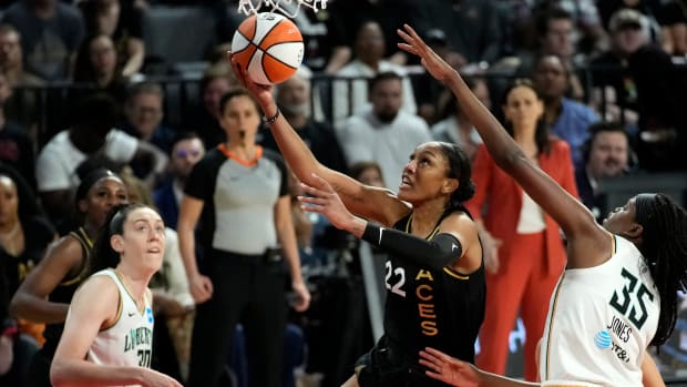 Las Vegas Aces forward A’ja Wilson shoots around New York Liberty players Jonquel Jones and Breanna Stewart during the WNBA Finals.